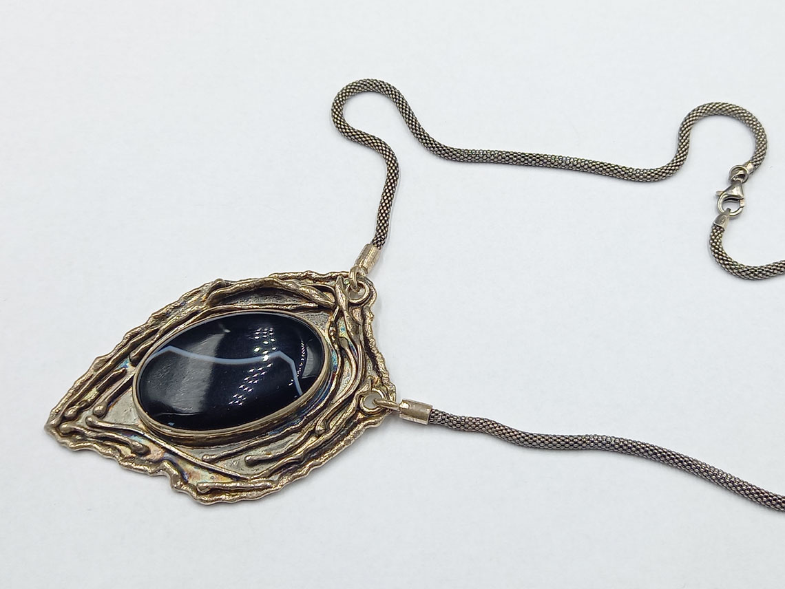 silver necklace with black onyx