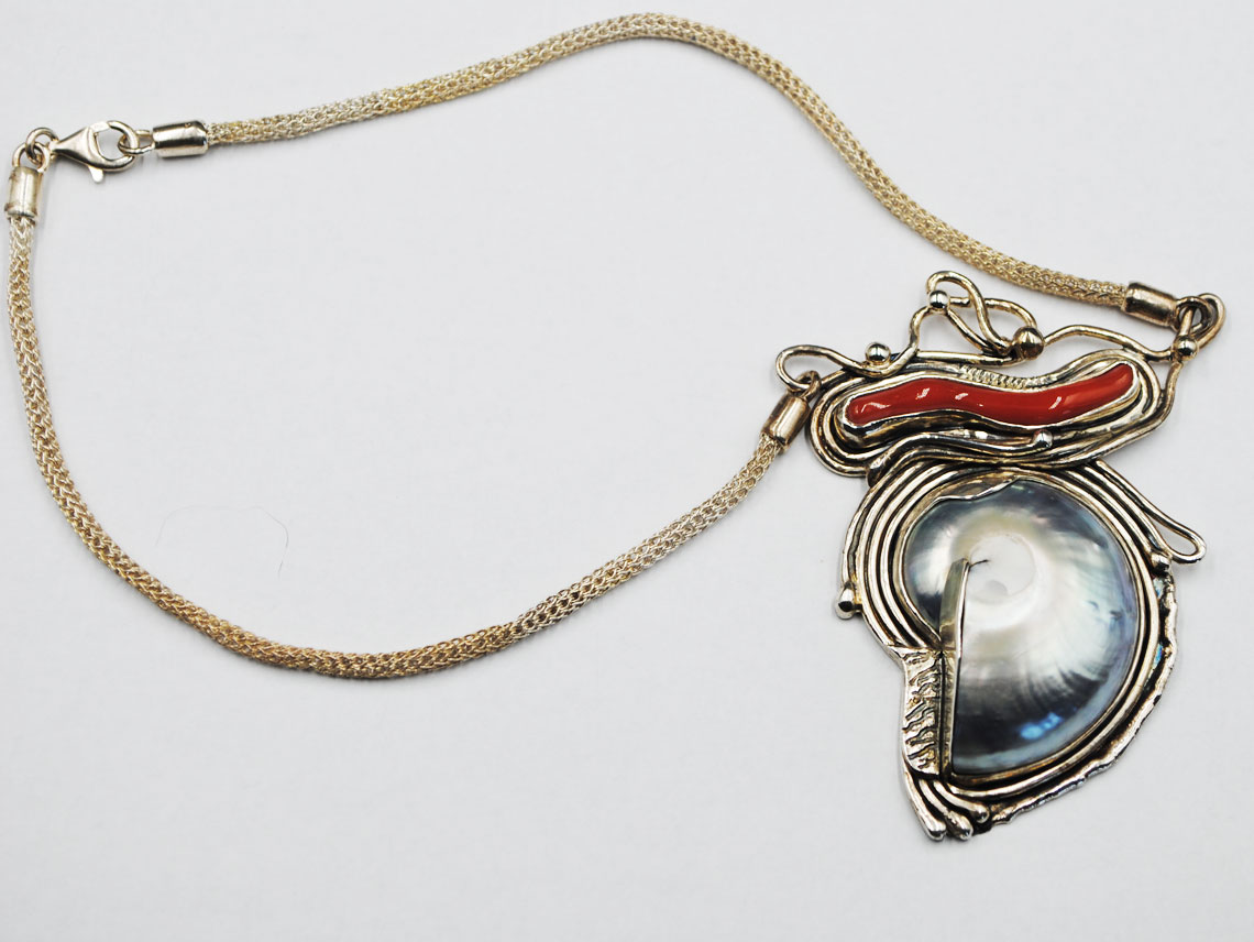 silver necklace with nautilus and coral