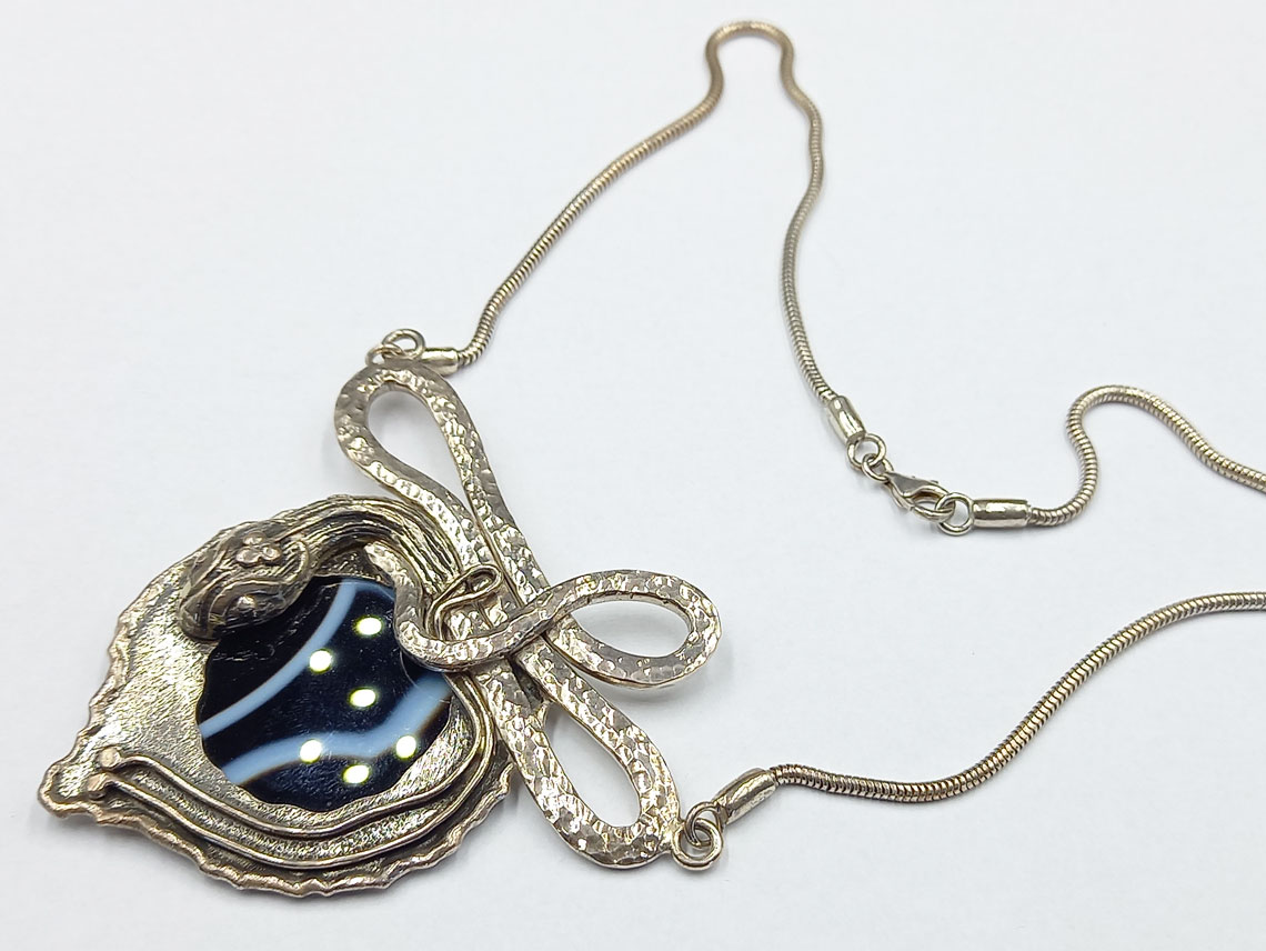 silver necklace with black onyx