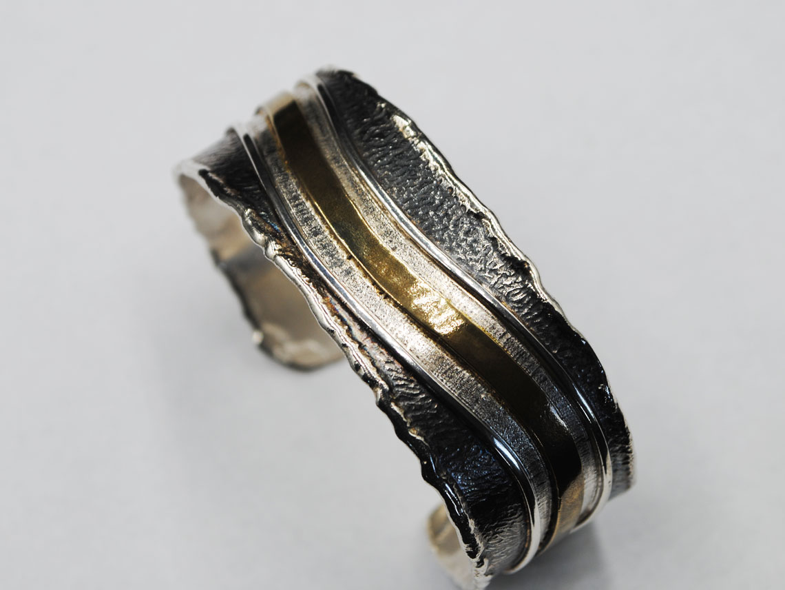 Silver bracelet oxidized with bronze